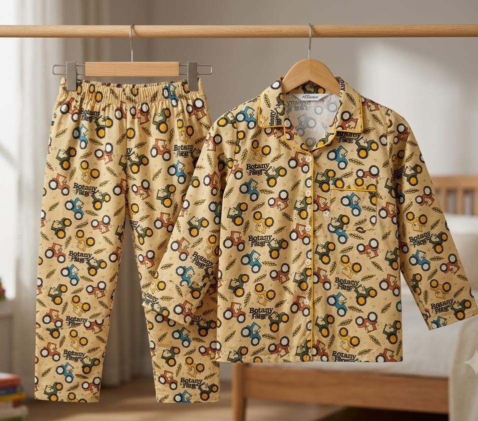 A two-piece pajama set hanging on wooden hangers from a clothing rack. The set includes a long-sleeve button-up pajama shirt and matching pants, both in a beige/tan base fabric with an all-over print of colorful toy cars and the words 'Super Car Pajama'.