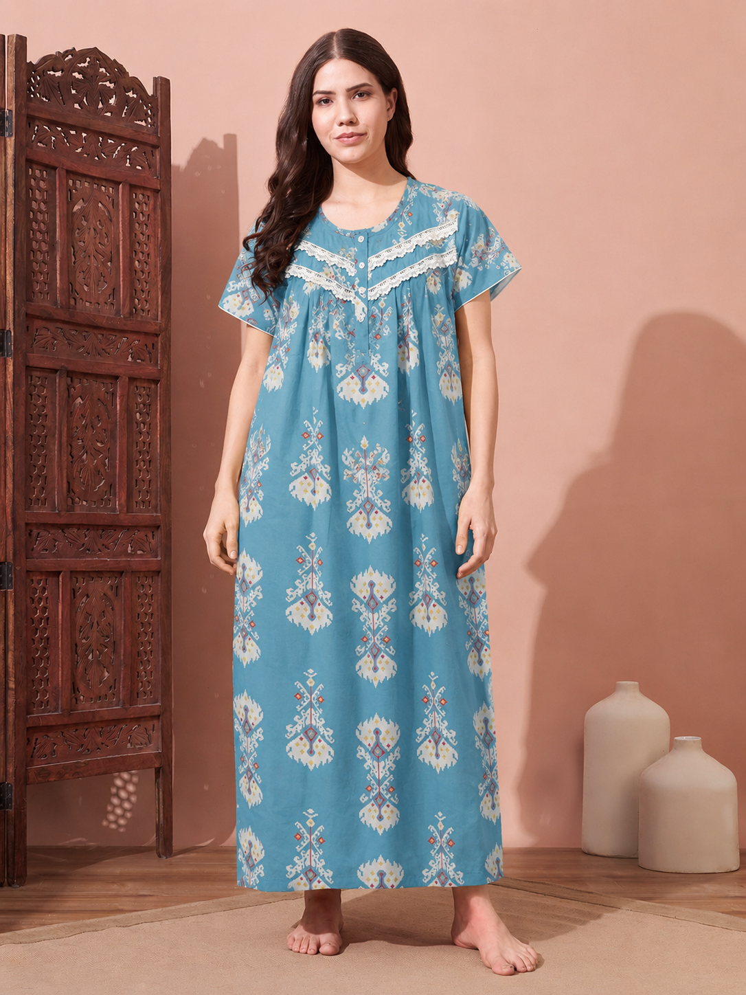 Women's sky blue full-length cotton night gown featuring ethnic print, lace neckline, and relaxed fit