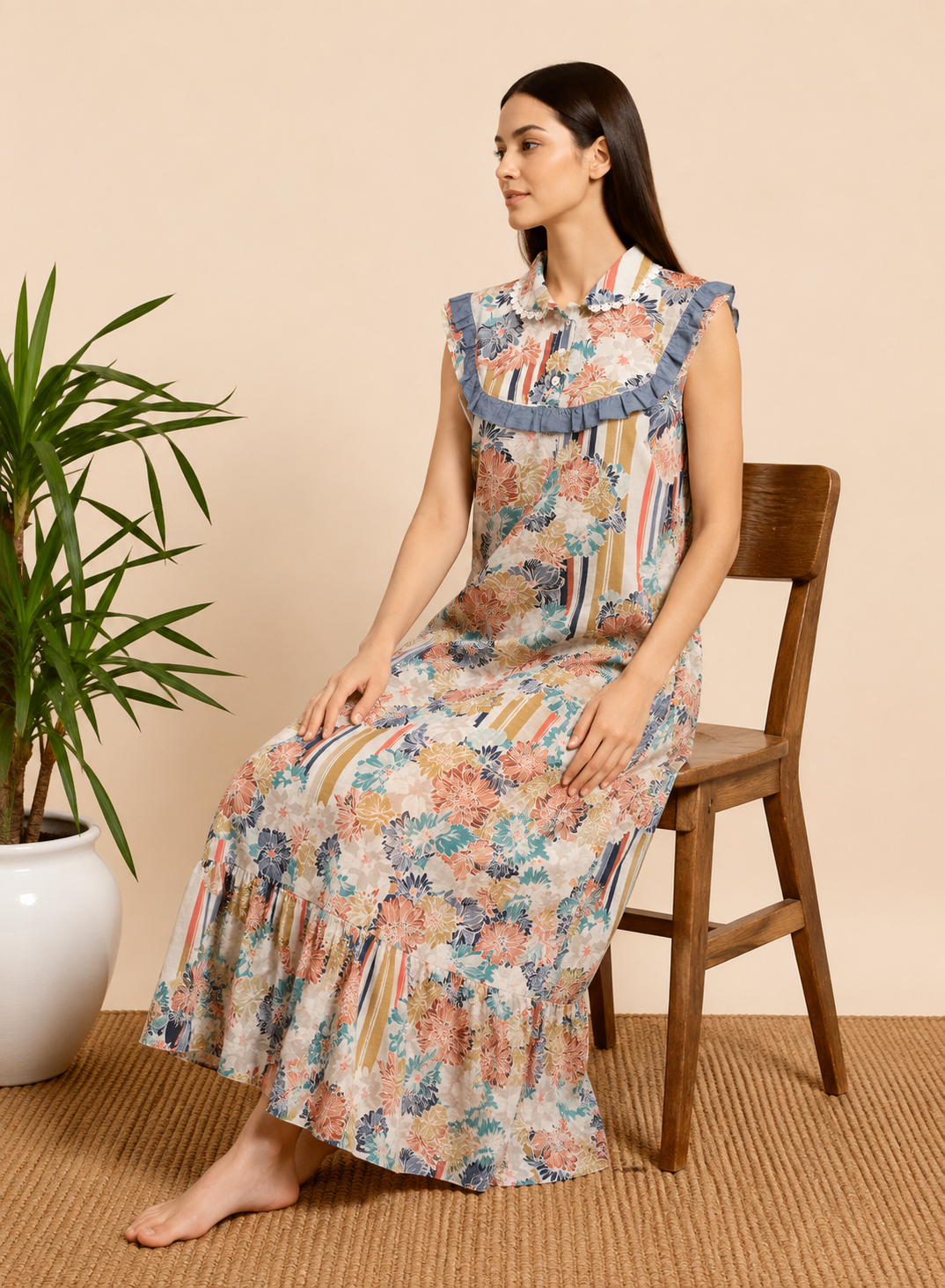 Women's full-length multicolor floral cotton night gown featuring sleeveless design, Peter Pan collar, floral print, and ruffle hem